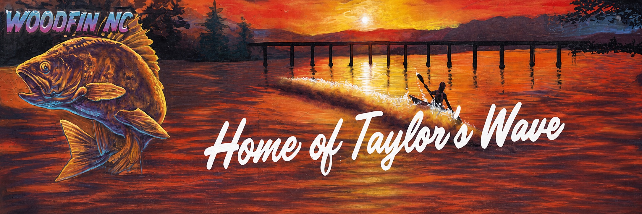 Colorful Woodfin mural reading Home of Taylor's Wave beside a fish and river scene